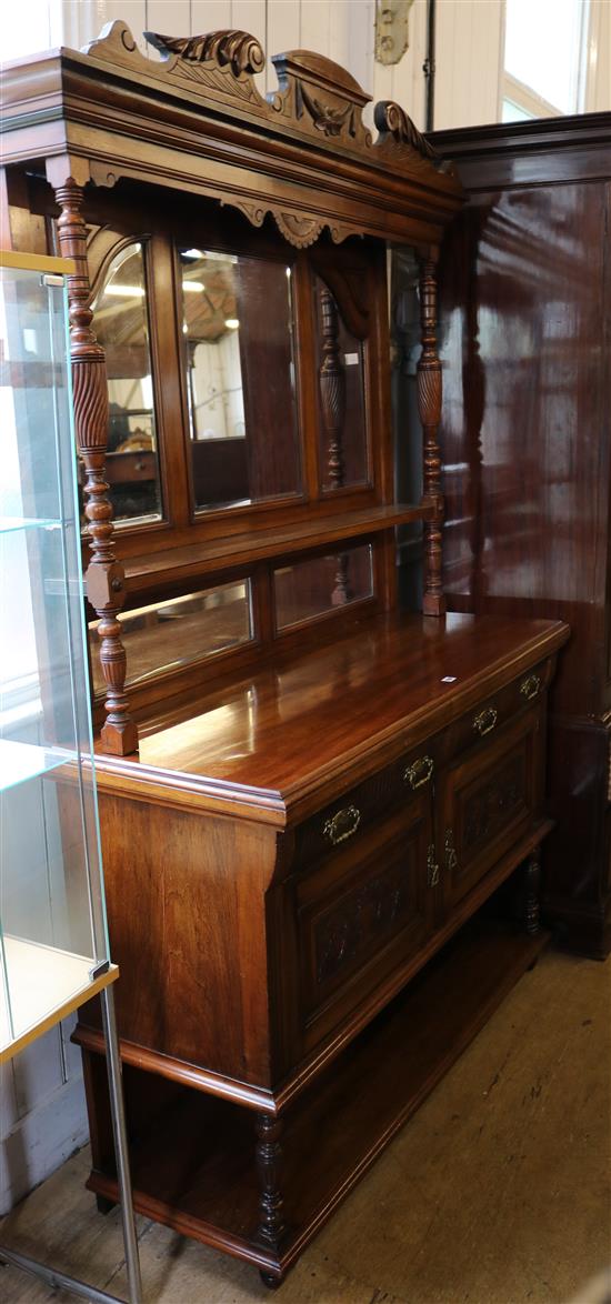 A late Victorian walnut sideboard, with mirrored back
